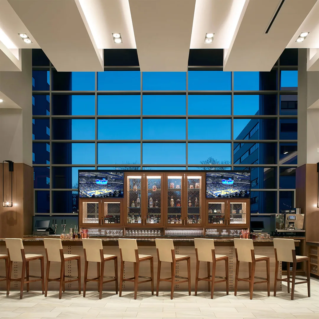 Custom hotel lobby bar millwork and back-bar casework